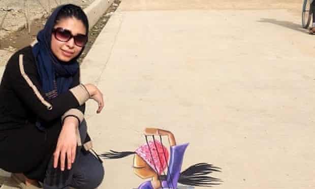 Shamsia beside what's reckoned to be the first ever piece of 3D street art on Afghanistan.