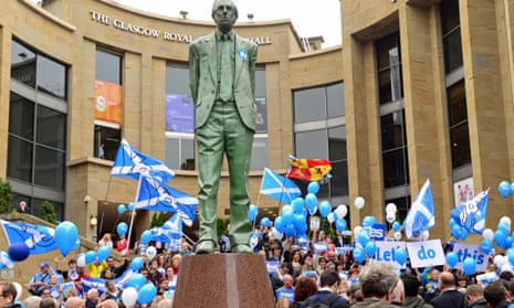 The statue of the late Donald Dewar, the Scottish parliament's first First Minister, overlooks a 'Yes' rally in Glasgow on the eve of polling.