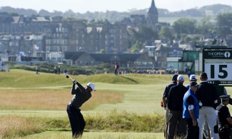 Tiger Woods swings into action on the 15th tee over the Old Course at St Andrews in 2010.
