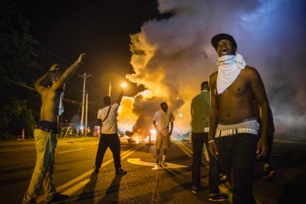 Demonstrators face tear-gas during protests in Ferguson, Missouri.