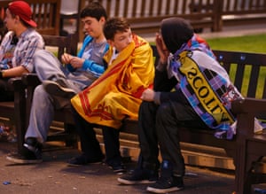 Young yes supporters wrapped in flags as the night draws to a close