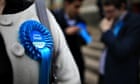 A conservative candidate wearing a rosette