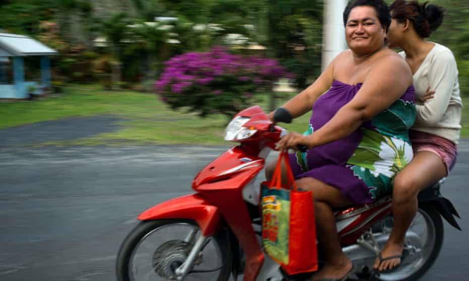 Two obese people drive a motorcycle on a road on the island of Rarotonga, Cook Island, 21 June 2013 . Obesity in the Pacific is a growing health concern with health officials stating that it is one of the leading causes of preventable deaths in the Pacific Rim.