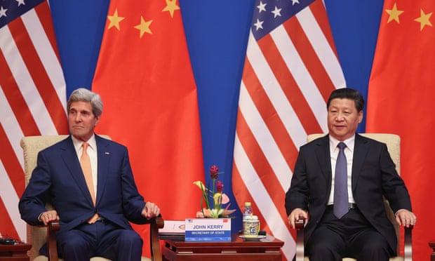 Xi Jinping (right) and US Secretary of State John Kerry. The Chinese president may skip a UN climate meeting in New York