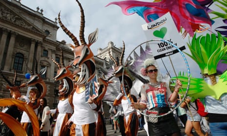Demonstrators in animal costumes walk in the "People's Climate March" in central London September 21, 2014.