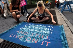 Demonstrators prepare a sign before the People's Climate March