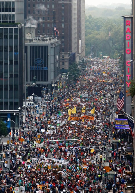 Demonstrators make their way down Sixth Avenue in New York during the People's Climate March Sunday, Sept. 21, 2014.