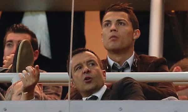 Jorge Mendes, front, watches a Real Madrid game with Cristiano Ronaldo in 2013.