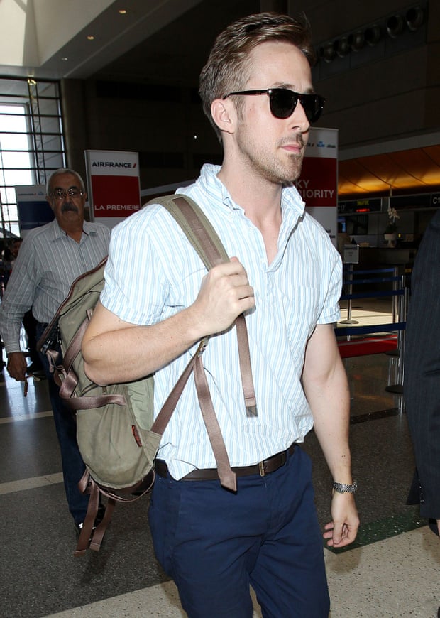 Ryan Goslin wears his backpack, daringly, on one shoulder only.