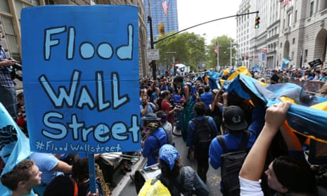 Protestors fill Broadway in lower Manhattan during a rally and protest called 'Flood Wall Street' in New York, New York, USA 22 September 2014.