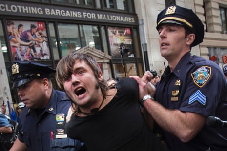 New York City police officers arrest a man taking part in the Flood Wall Street demonstration in Lower Manhattan, New York September 22, 2014.