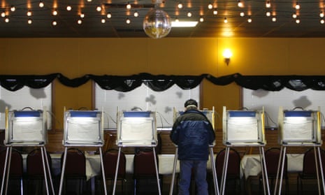 A voter casts his ballot at Country Keg & Pub Restaurant in Cedarburg, Wisconsin.