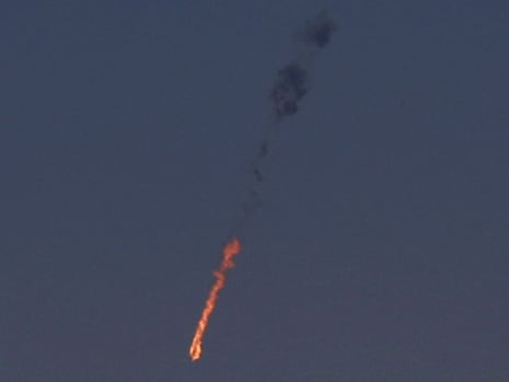 The Syrian fighter jet is seen in flames after it was hit by the Israeli military over the Golan Heights