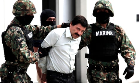 Mexican marines lead away Joaquín Guzmán after his arrest in February 2014.