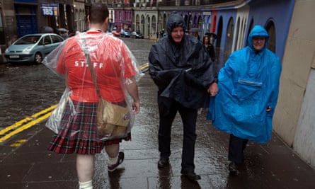 Some Edinburgh festival tourists negotiate some dreich weather