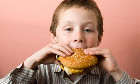 Boy eating a McDonald's burger