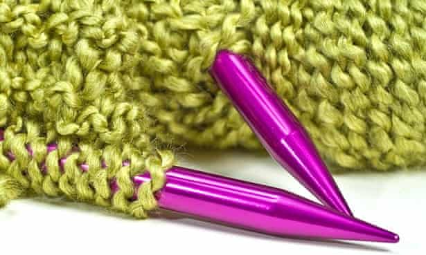 Knitting needles and yarn.