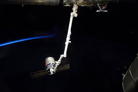 Surrounded by the blackness of space, the International Space Station's Canadarm2