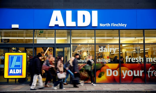 Pedestrians pass an Aldi supermarket in the North Finchley district of London. The chain is currentl