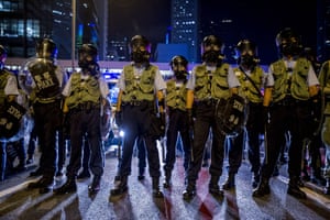 Police officers stand guard during clashes with pro-democracy protesters in Hong Kong.