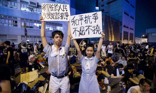High-school demonstrators hold signs during a protest outside the headquarters of Legislative Council in Hong Kong.