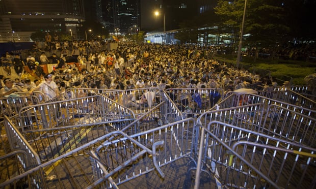 Student protestors attend an overnight mass sit-in in front of Hong Kong's central government offices.