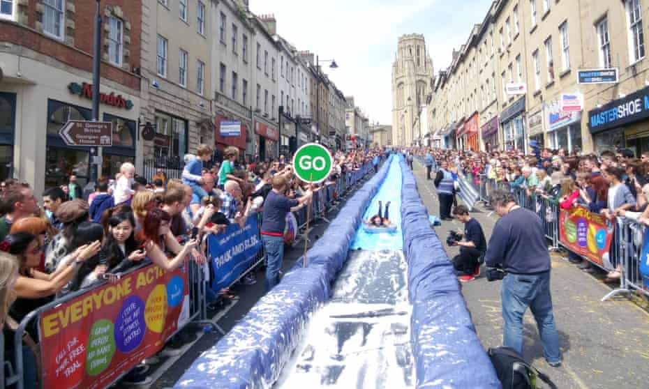 Luke Jerram's crowdfunded Park and Slide project temporarily transformed Park Street in Bristol into a giant water slide