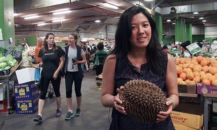 Monica Tan holding a monster durian.