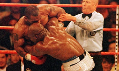 Mike Tyson bites Evander Holyfield