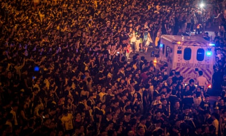 Protesters create space for an ambulance to pass during protests outside the Hong Kong Government Complex on September 30, 2014 in Hong Kong, Hong Kong.