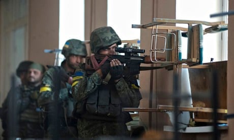 Ukrainian servicemen are seen at their position during fighting with pro-Russian separatists