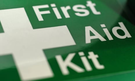 First aid kit in a green box.