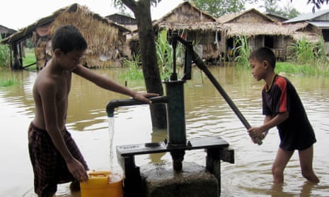 Boys at a water pump in Burma