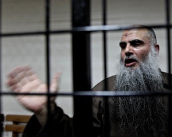 Islamist cleric Abu Qatada speaks to the media after a hearing in Amman, Jordan
