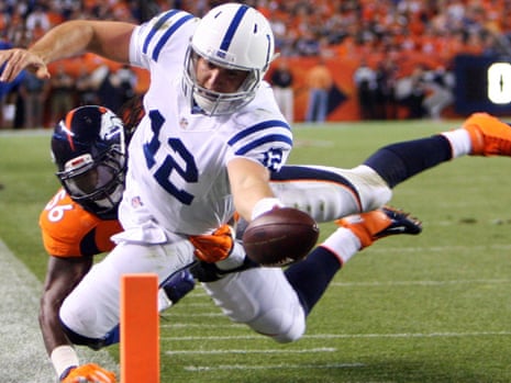 Andrew Luck runs for a touchdown before the end of the second quarter to keep the Indianapolis Colts in touch with the Broncos in Denver.