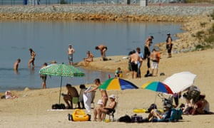 Bathers enjoy the water at a beach at Baerwalder See lake on August 21, 2010 near Boxberg, Germany.