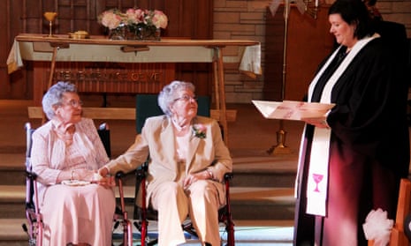 Reverend Linda Hunsaker presides over the wedding of Vivian Boyack, left, and Alice  Dubes, center, in Davenport.