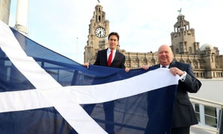Liverpool City Council leader Joe Anderson and Labour leader, Ed Miliband (right) raising a Saltire on Liverpool waterfront.