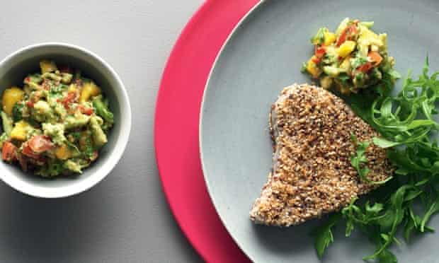 Sesame and Szechuan-coated seared tuna steak with coriander, mango and chilli guacomole 'salsa'.
