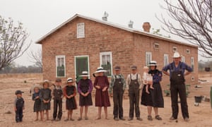 Bolivia. Durango colony. Mennonite family in front of their house. From right to left: Gerhard Klassen (36), Anna Bren (35) with baby Sarah (1), Heinrich (13), Peter (12), Eva (11), Catarina (9), Anna (8), Gerhard (6), Elisabet (5), Elena (3) and Jacob (2).