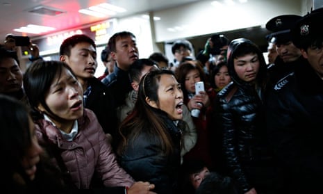 Relatives arrive at the hospital where the injured were taken following a stampede on New Year's eve