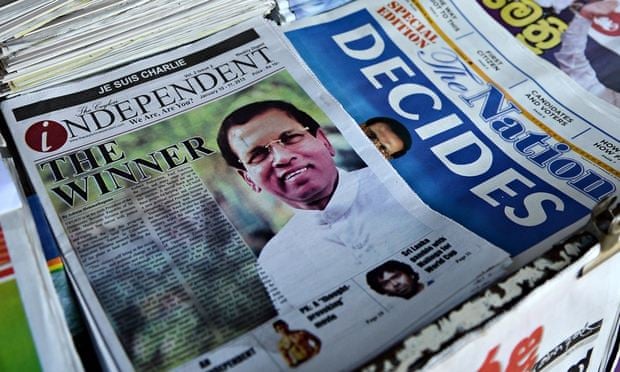Newspapers at a stall in Colombo show headlines about Sri Lanka's new president Maithripala Sirisena