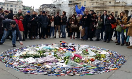 People adding to the pen circle in Trafalgar square, London on Sunday 11 January, as a tribute to those who lost their life in the Paris attacks