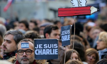 A man holds a placard reading "Je suis Charlie" (I am Charlie) during the rally.