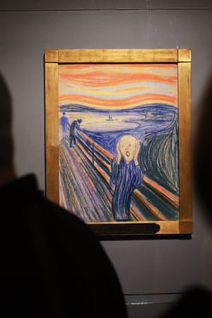 People look at Edvard Munch's 'The Scream' in Manhattan's Museum of Modern Art (MOMA) in New York.