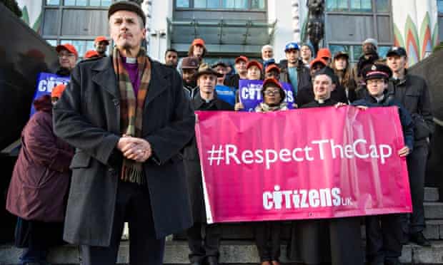 The bishop of Stepney, the Rt Revd Adrian Newman, and others demonstrate in support of lending cap 