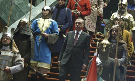 Turkish president Recep Tayyip Erdogan walks between the guards wearing Turkish warriors' costumes.