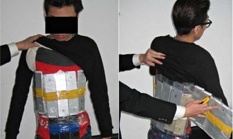 The man with the dozens of shrink-wrapped iPhones strapped to his body