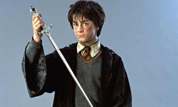 HARRY POTTER holding wand