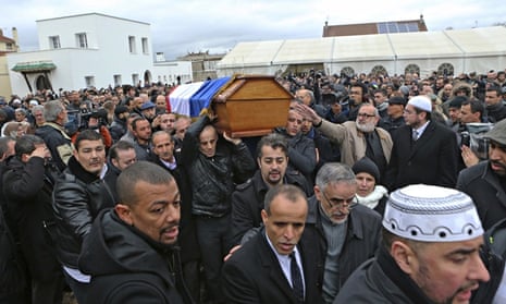 People carry the coffin of murdered police officer Ahmed Merabet after a funeral service at the Bobi